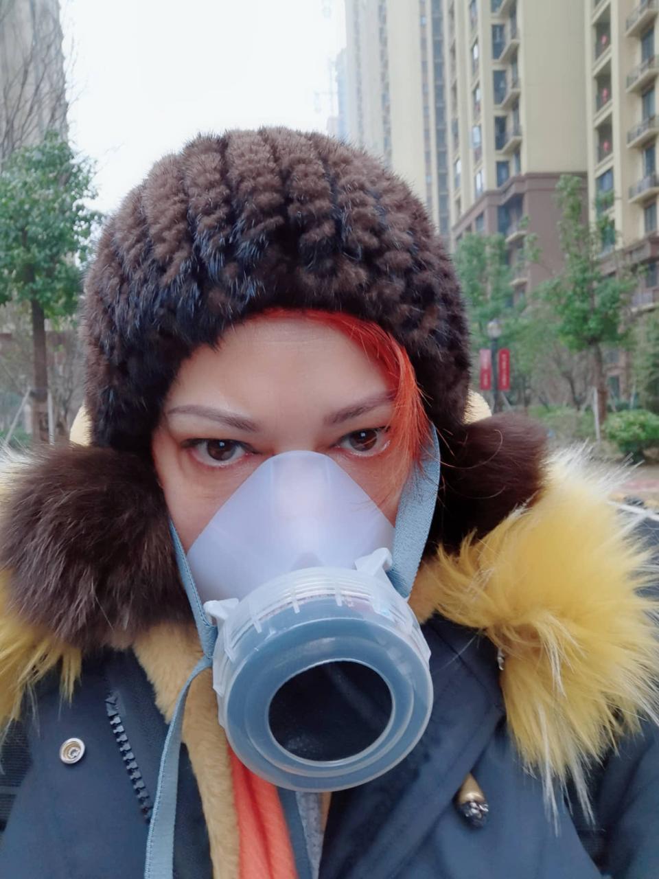 American Diana Adama wears a mask in Wuhan, China on Jan. 24, 2020.