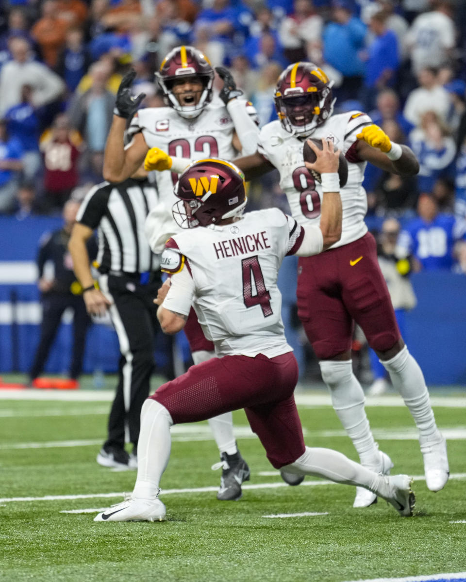 Washington Commanders quarterback Taylor Heinicke (4) celebrates a touchdown in the final minute of the second half against the Indianapolis Colts of an NFL football game in Indianapolis, Fla., Sunday, Oct. 30, 2022. (AP Photo/AJ Mast)