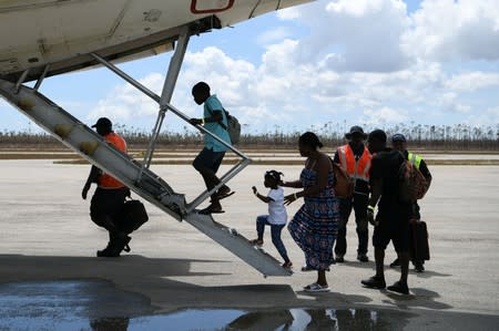 Abaco residents are evacuated from the island at the airport in the wake of Hurricane Dorian in Marsh Harbour