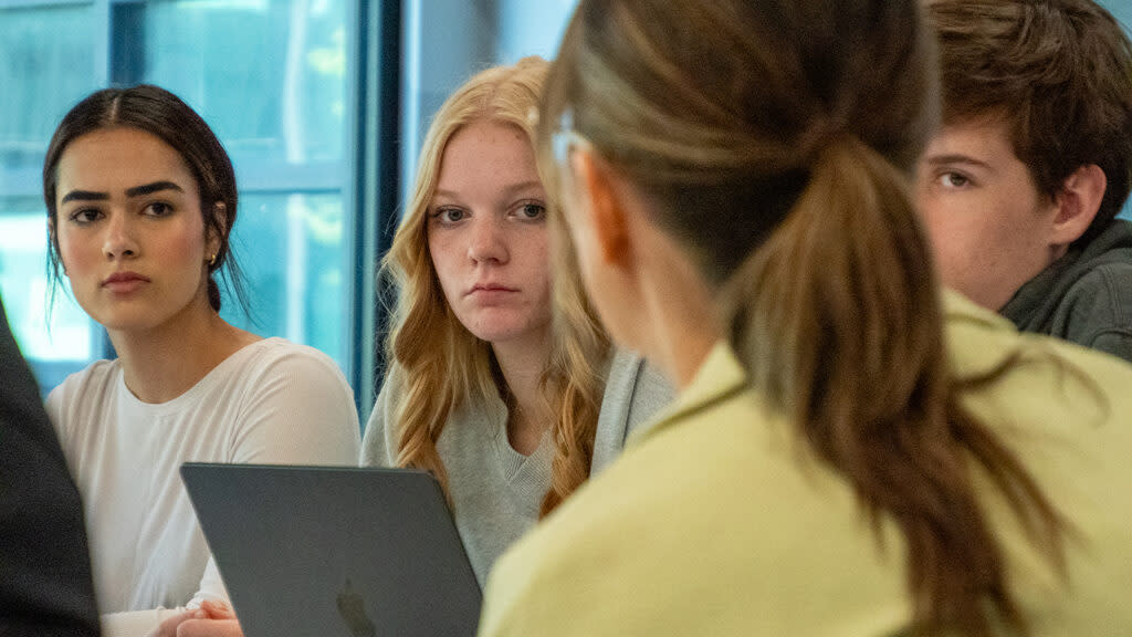 From left, Lawrence High School student journalists Natasha Torkzaban, Maya Smith and Morgan Salisbury meet April 19, 2024, with school board president Kelly Jones