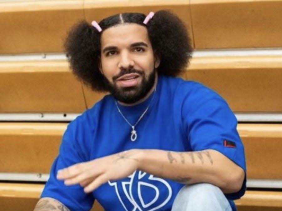 Drake with two buns and a barrette in his hair.