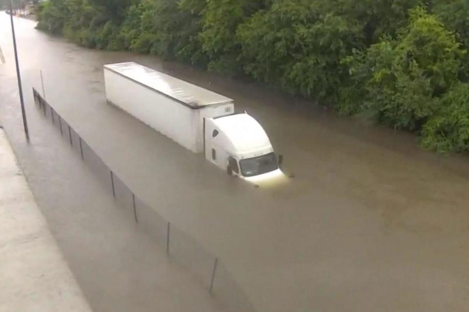 The lorry stalled in at least 10ft of floodwater in Houston (KHOU)