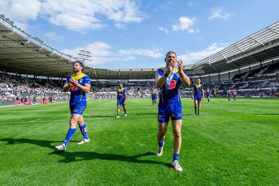 The Wire players applaud their fans following Saturday's victory over Hull FC <i>(Image: SWPix.com)</i>