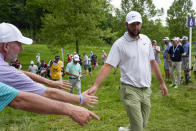 Scottie Scheffler greets fans on the way to sixth tee during the first round of the PGA Championship golf tournament at the Valhalla Golf Club, Thursday, May 16, 2024, in Louisville, Ky. (AP Photo/Matt York)