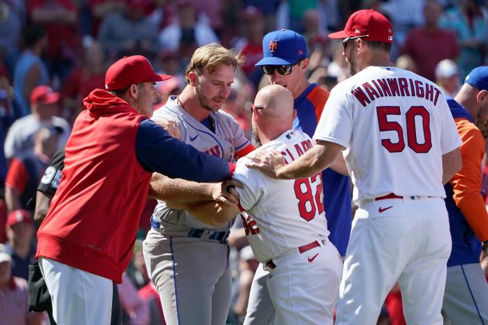 New York Mets&#39; Pete Alonso and St. Louis Cardinals first base coach Stubby Clapp (82) scuffle as benches clear during the eighth inning of a baseball game Wednesday, April 27, 2022, in St. Louis. Clapp was ejected from the game. (AP Photo/Jeff Roberson)