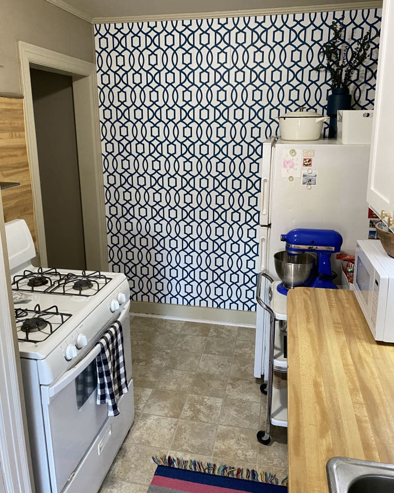 kitchen with black and white patterned wallpaper wall after renovation