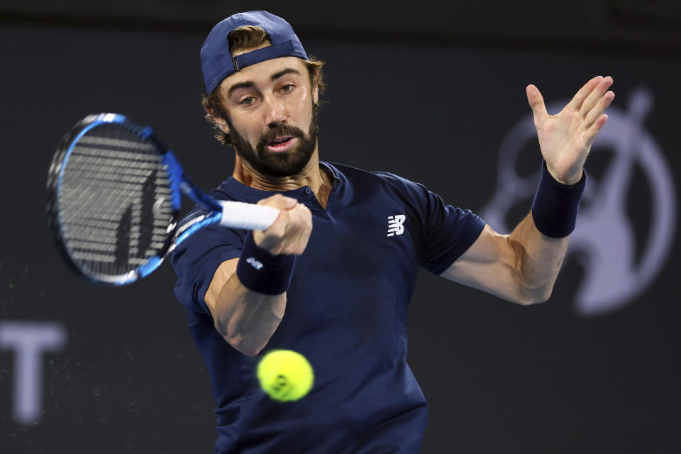 Jordan Thompson of Australia plays a shot in his quarter-final match against Rafael Nadal of Spain during the Brisbane International tennis tournament in Brisbane, Australia, Friday, Jan. 5, 2024. (AP Photo/Tertius Pickard)