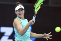 Jennifer Brady of the United States plays a shot during her match against Ashleigh Barty of Australia at the Brisbane International tennis tournament in Brisbane, Australia, Thursday, Jan. 9, 2020. (AP Photo/Tertius Pickard)