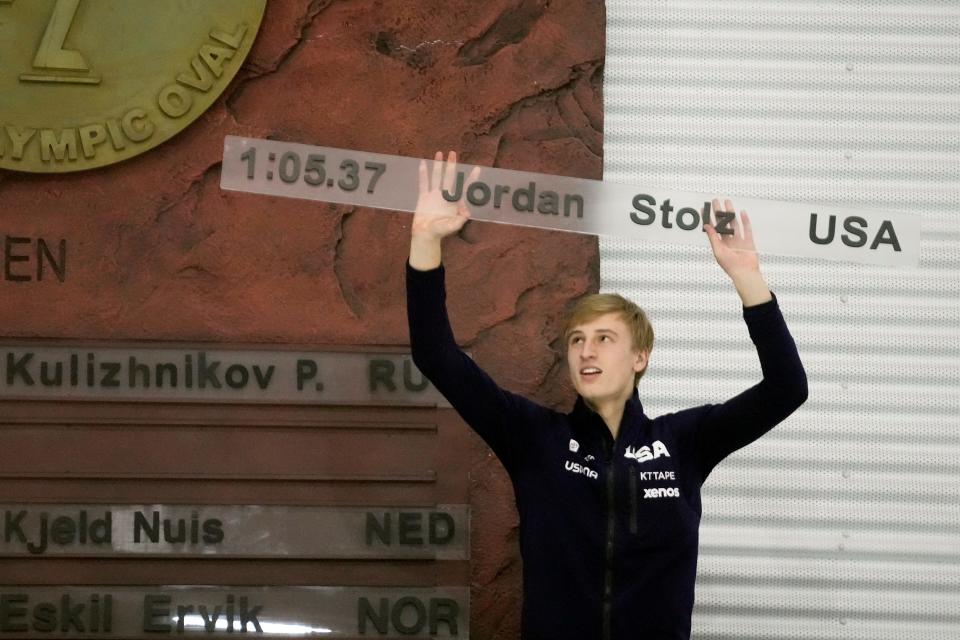 Jordan Stolz, of the United States, who broke the men's 1,000 meters world record, holds a board with his name and time to be added to a display at the Utah Olympic Oval during the ISU World Cup speedskating event Friday, Jan. 26, 2024, in Kearns, Utah. (AP Photo/Rick Bowmer)