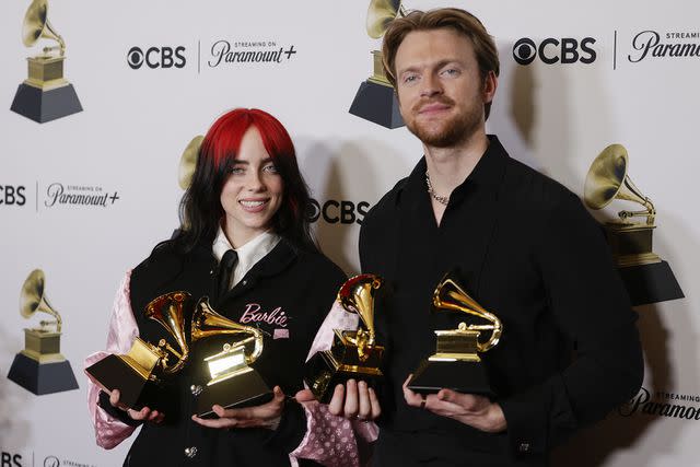 <p>Francis Specker/CBS via Getty Images</p> Billie Eilish and her brother Finneas in the press room at the 2024 Grammys.