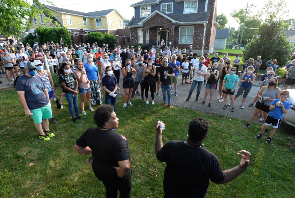 Shawn Dromgoole thanks neighbors and others in the crowd after they walked with him in his neighborhood on Thursday, June 4, 2020, in Nashville, Tenn. Dromgoole said last week he was afraid to walk in his neighborhood after the George Floyd killing so his neighbors said they would walk with him. His post on Facebook got attention, and hundreds walked with him Thursday evening.