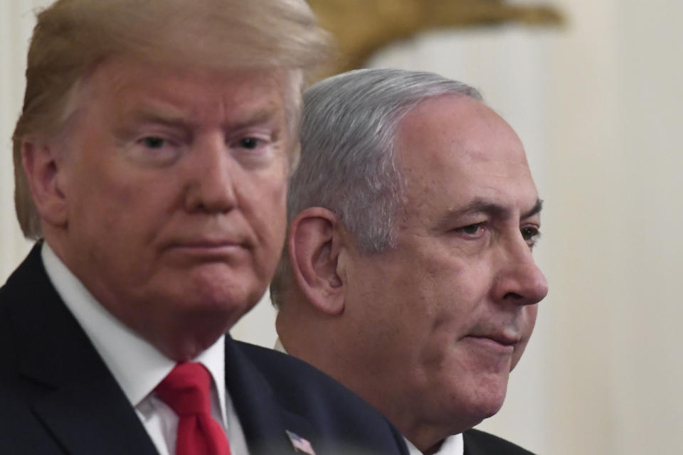 President Donald Trump, left, and Israeli Prime Minister Benjamin Netanyahu, right, during an event in the East Room of the White House in Washington, Tuesday, Jan. 28, 2020, to announce the Trump administration's much-anticipated plan to resolve the Israeli-Palestinian conflict. (AP Photo/Susan Walsh)