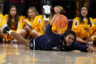 Jackson State forward Terence Lewis II dives for a loose ball during the second half of an NCAA college basketball game against Iowa State, Sunday, Dec. 12, 2021, in Ames, Iowa. Iowa State won 47-37. (AP Photo/Charlie Neibergall)