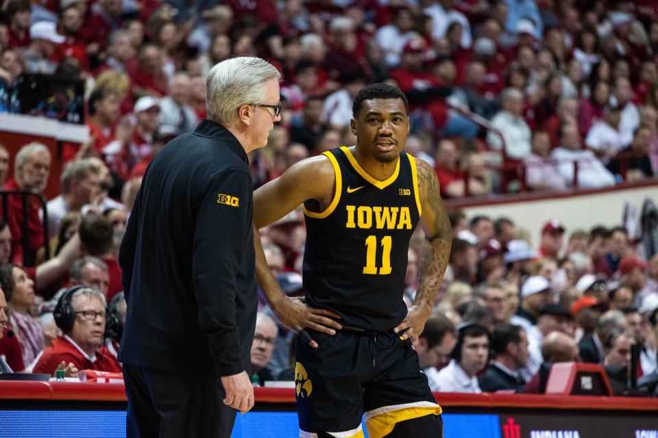Feb 28, 2023; Bloomington, Indiana, USA; Iowa Hawkeyes head coach Fran McCaffery and guard Tony Perkins (11) in the first half against the Indiana Hoosiers at Simon Skjodt Assembly Hall.