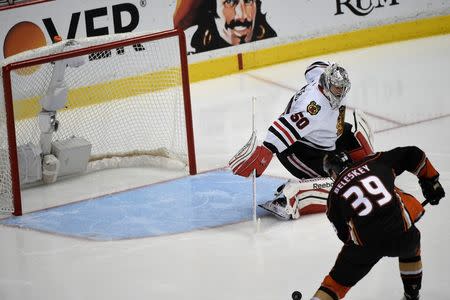 Anaheim Ducks left wing Matt Beleskey (39) scores a goal against Chicago Blackhawks goalie Corey Crawford (50) during the overtime period in game five of the Western Conference Final of the 2015 Stanley Cup Playoffs at Honda Center. Mandatory Credit: Richard Mackson-USA TODAY Sports