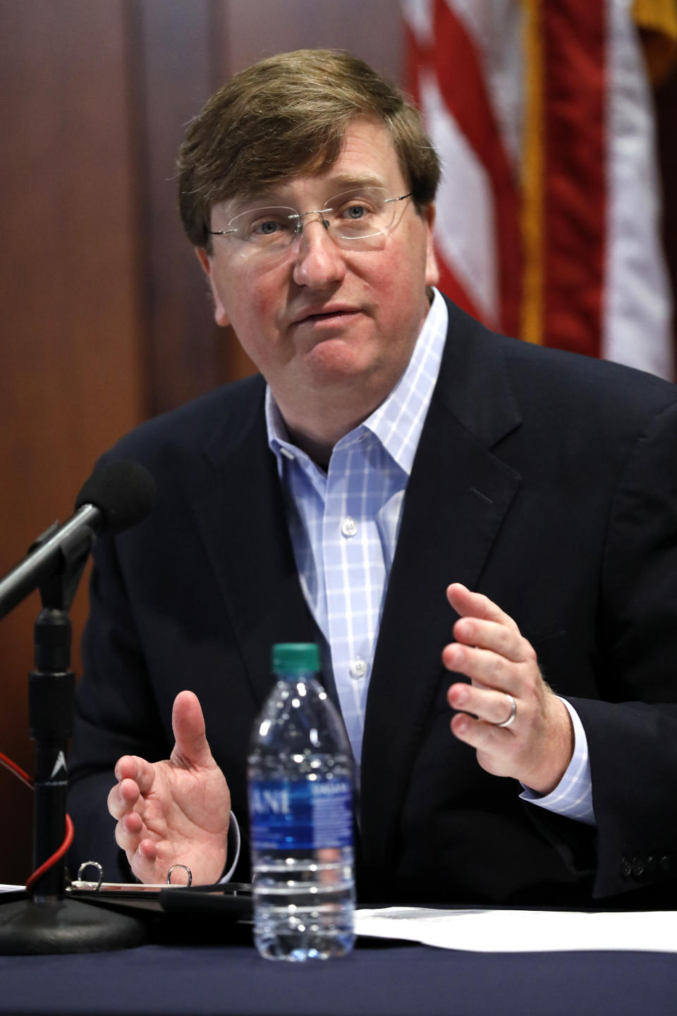 Gov. Tate Reeves stresses the need for personal responsibility in wearing face masks during his opening statement at a coronavirus news briefing, Wednesday, July 8, 2020 in Jackson, Miss. (AP Photo/Rogelio V. Solis)