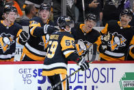 Pittsburgh Penguins' Jake Guentzel (59) returns to the bench after scoring during the second period of the team's NHL hockey game against the Philadelphia Flyers in Pittsburgh, Thursday, Nov. 4, 2021. (AP Photo/Gene J. Puskar)