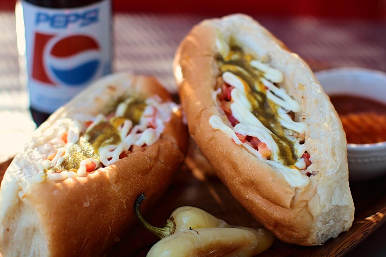 Piled high with condiments and bursting out of its specialty bun, the Sonoran dog is believed to have been invented in Sonora, the Mexican state that gave it its name and borders Arizona. (Photo: El Guero Canelo)