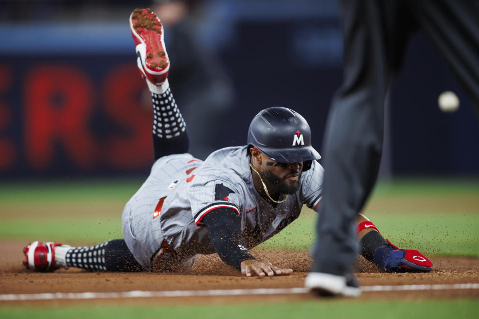 Minnesota Twins' Willi Castro reaches third base on an RBI single by Jose Miranda against the Toronto Blue Jays during the first inning of a baseball game Friday, May 10, 2024, in Toronto. (Cole Burtson/The Canadian Press via AP)