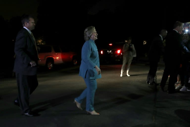 Democratic presidential nominee Hillary Clinton preapres to greet supporters after attending a fundraiser on August 23, 2016 in Piedmont, California