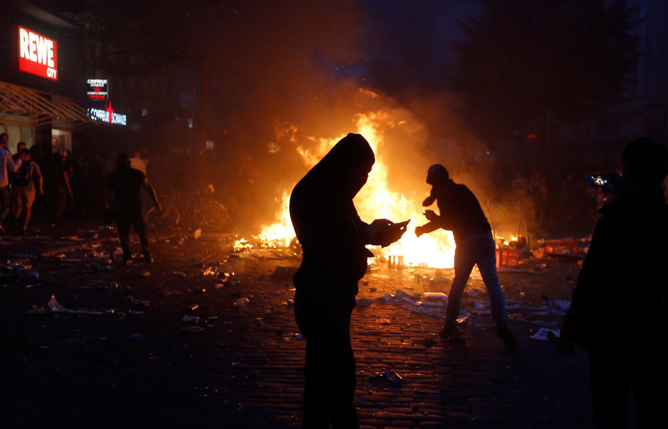 <p>A barricade is set on fire during a protest against the G-20 summit in Hamburg, northern Germany, Friday, July 7, 2017. (Michael Probst/AP) </p>