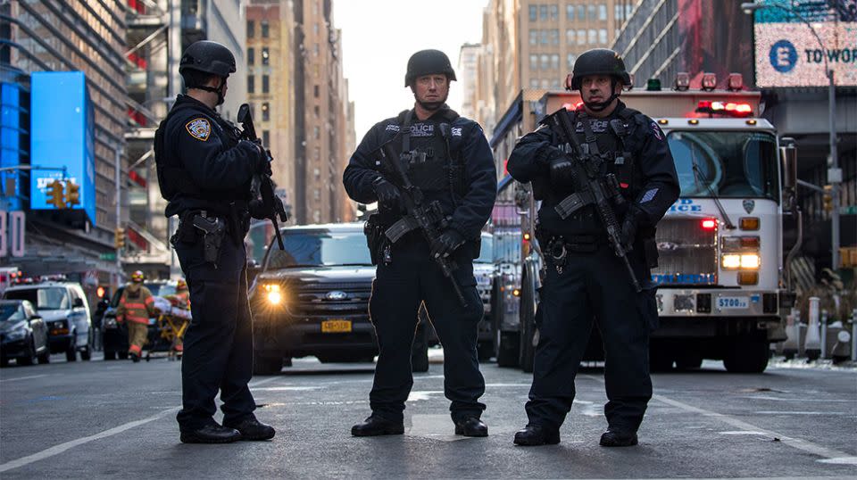 New York City Police Department officers stand guard near the New York Port Authority Bus Terminal. Source: Getty