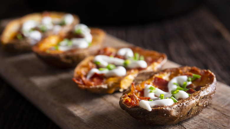 Potato skins on wooden board