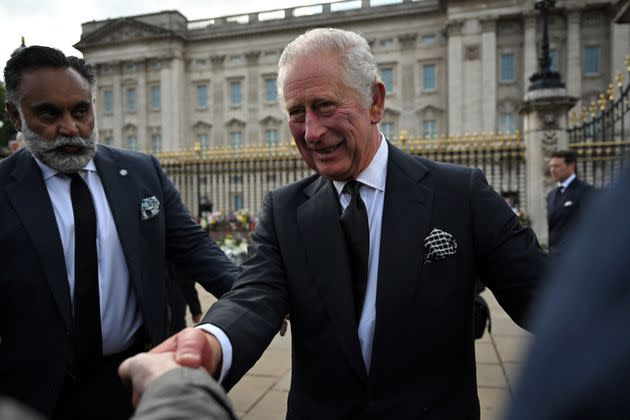 King Charles III greets the members of the public in the crowd upon his arrival at Buckingham Palace. (Photo: BEN STANSALL via Getty Images)