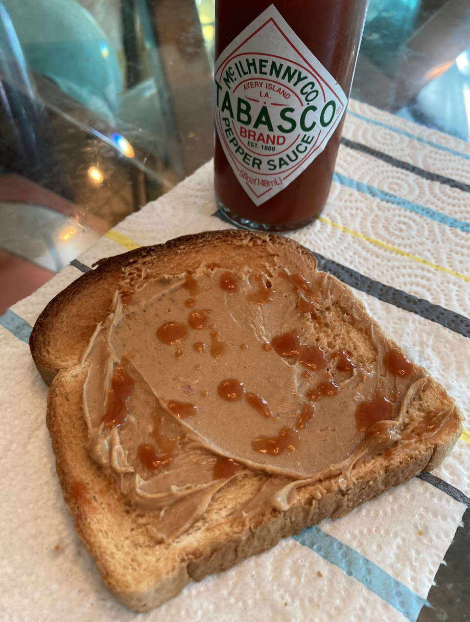 toast with peanut butter and hot sauce drizzled on