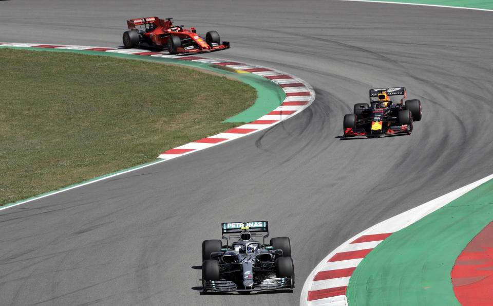 Mercedes driver Valtteri Bottas of Finland leads Red Bull driver Max Verstappen of the Netherland's and Ferrari driver Sebastian Vettel of Germany during the Spanish Formula One race at the Barcelona Catalunya racetrack in Montmelo, just outside Barcelona, Spain, Sunday, May 12, 2019. (AP Photo/Emilio Morenatti)