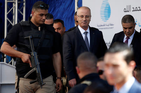 FILE PHOTO: Palestinian Prime Minister Rami Hamdallah arrives at the inauguration ceremony of a waste treatment plant after an explosion targeted his convoy, in the northern Gaza Strip March 13, 2018. REUTERS/Mohammed Salem