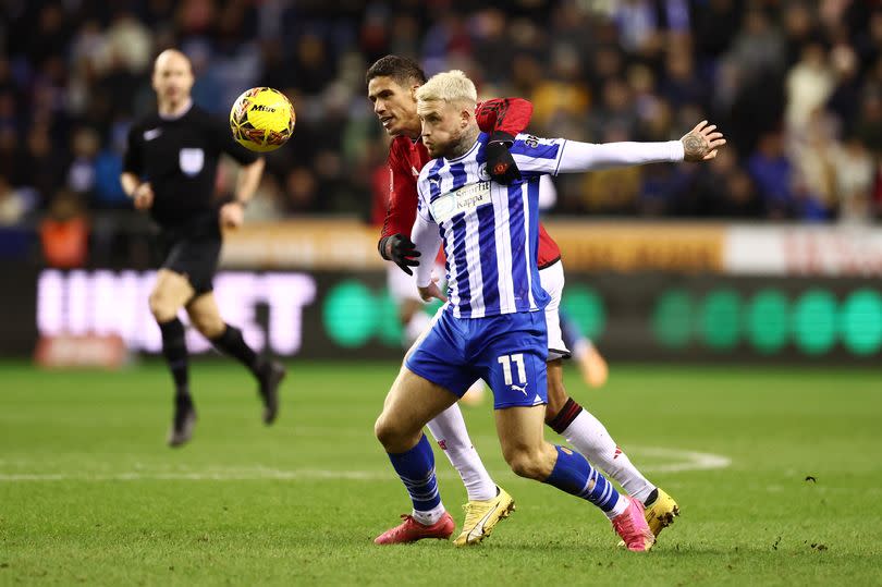 Stephen Humphrys in action for Wigan against Manchester United -Credit:Naomi Baker/Getty Images