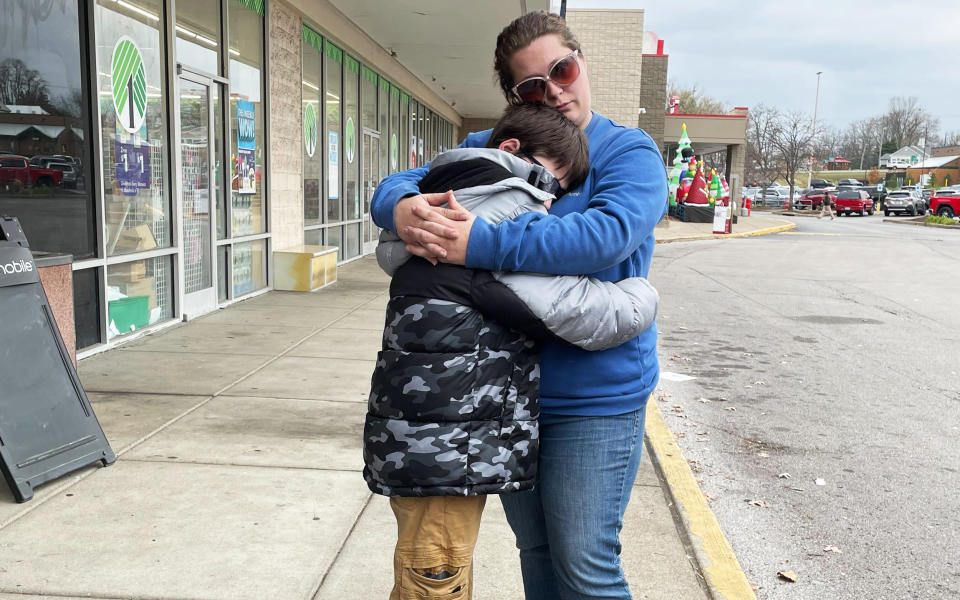 Anthony and Autumn Janeway hug at a shopping plaza (Safia Samee Ali / NBC News)