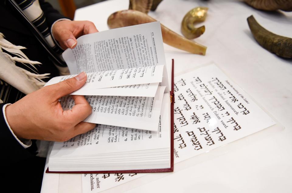 Rabbi Yitzchok Tiechtel reads through passages as he prepares to celebrate Rosh Hashanah at the Chabad Center Tuesday, Sept. 19, 2017 in Nashville, Tenn.