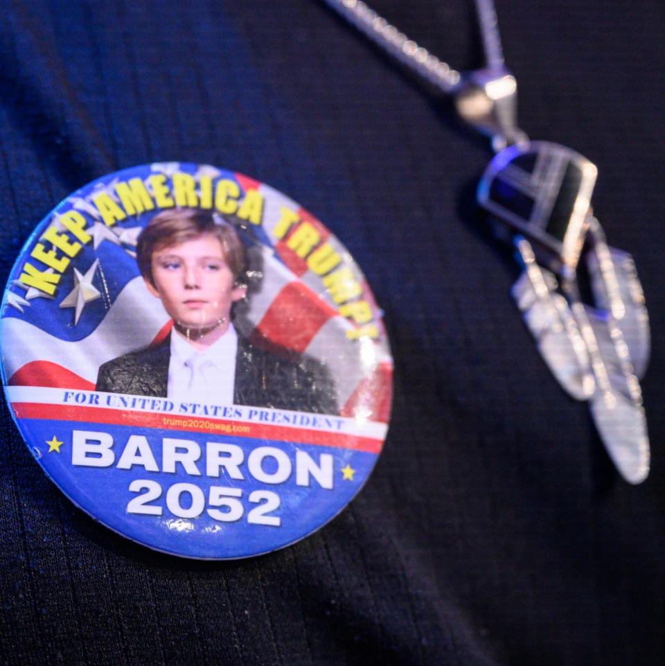 An audience member wears a Keep America Trump! Barron 2052 badge at Fox News Channel Studios on March 15, 2023 in New York