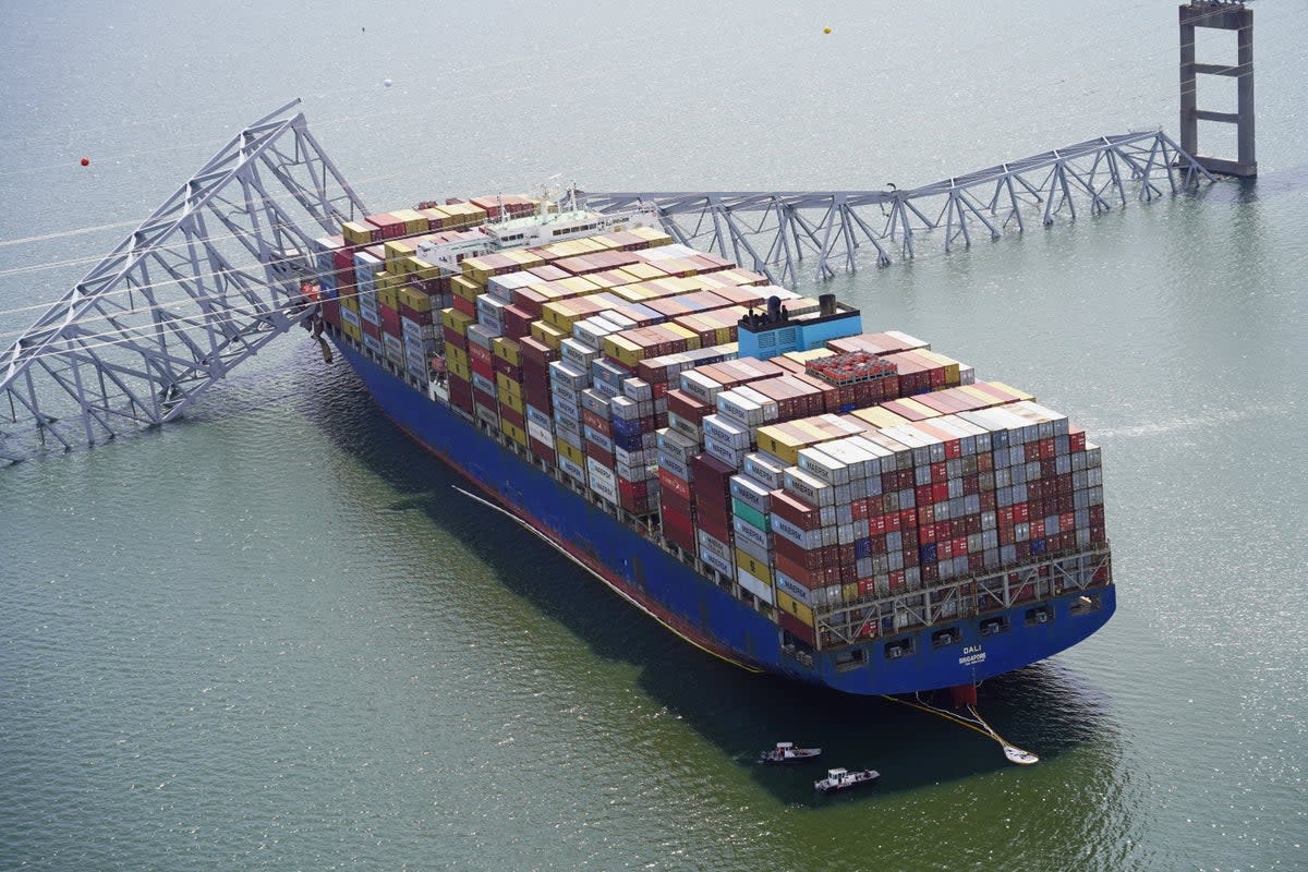 The 1,000ft container ship Dali was an hour into its voyage to Sri Lanka when it struck the bridge (via Reuters)