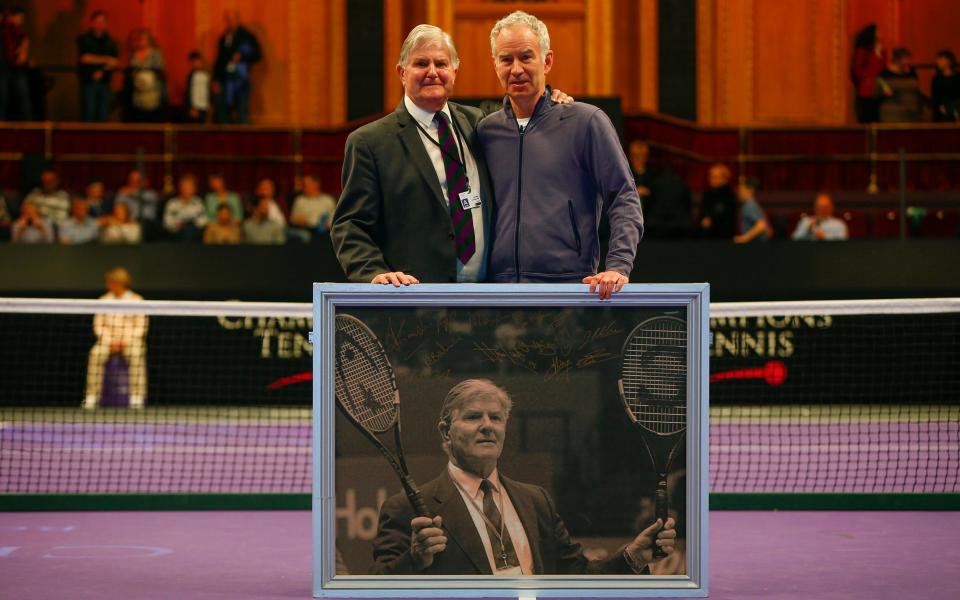 With McEnroe, right, after Mills announced his retirement from refereeing during the Masters Tennis at the Royal Albert Hall, London, December 2015