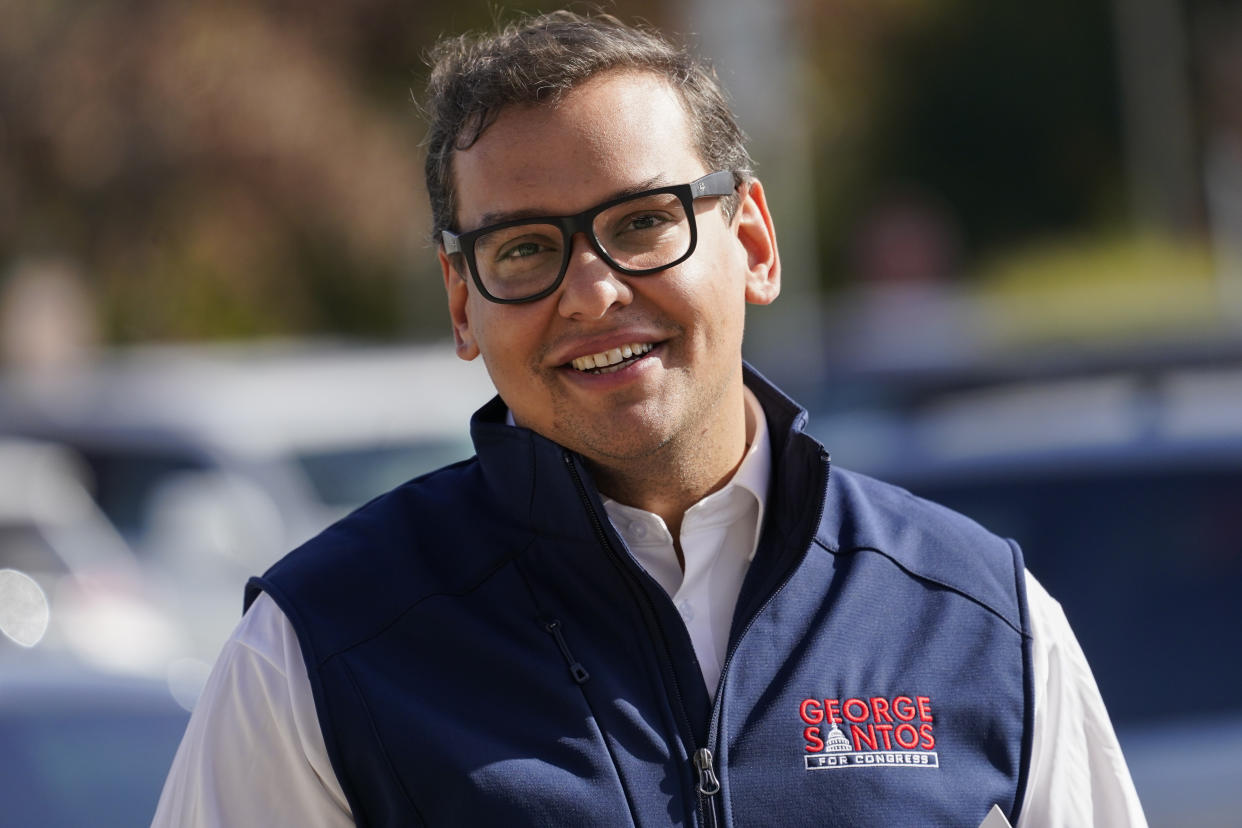 FILE - Republican candidate for New York's 3rd Congressional District George Santos campaigns outside a Stop and Shop store, Saturday, Nov. 5, 2022, in Glen Cove, N.Y. Santos, who won a seat in Congress in the November election is under pressure to explain himself amid evidence that he fabricated parts of the life story that endeared him to New York voters. (AP Photo/Mary Altaffer, File)