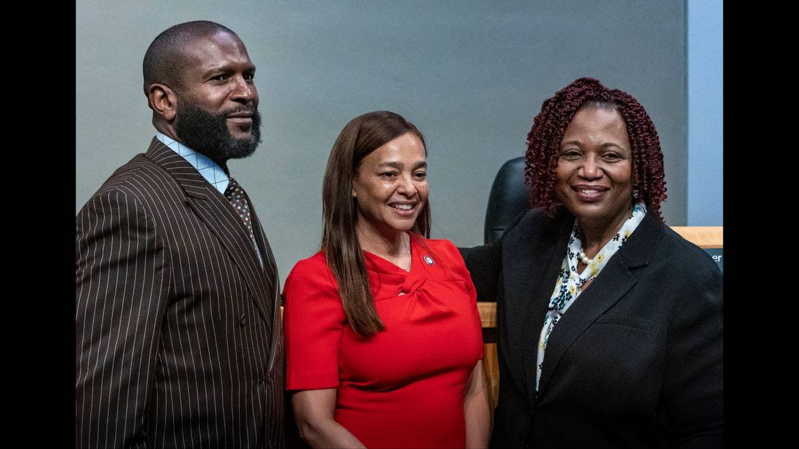 Bonita Jones-Peabody, right, and Vincent Brown, left, flank Commissioner Christine King after they were appointed to the board of the Virginia Key Beach Park Trust this month..