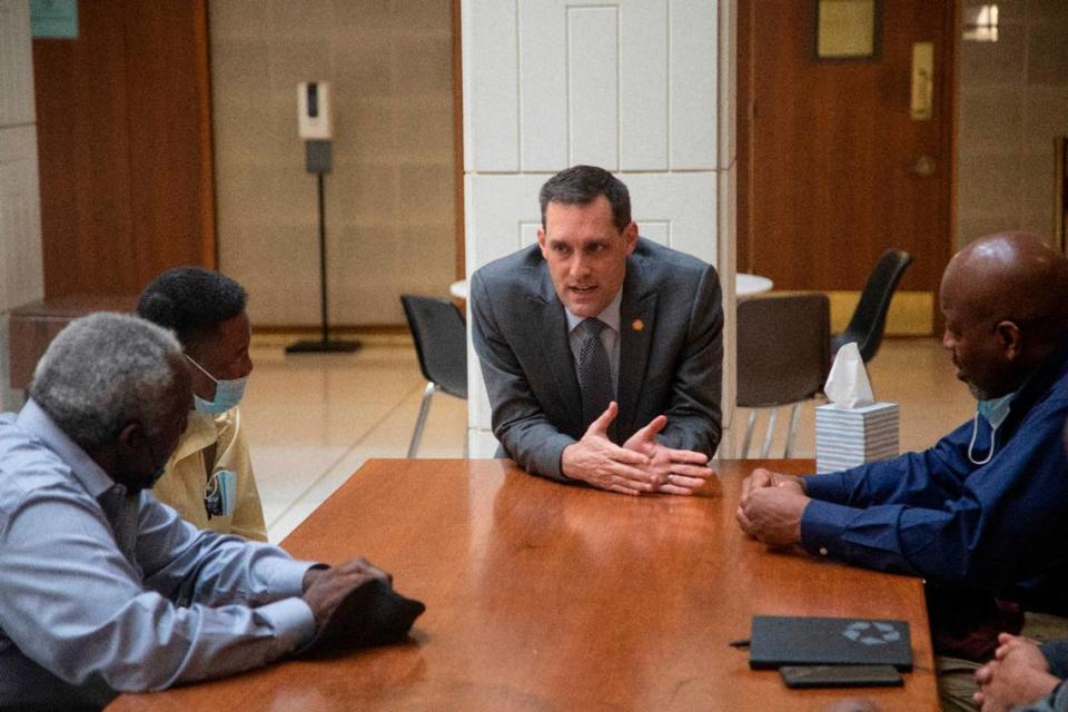 State Sen. Graig Meyer, center, meets with a group of Black farmers including Moe Matthews, far left, Calvin Jones, and Charles Jones, right, at the North Carolina Legislative Building Thursday, Feb. 23, 2023. The farmers criticized the language of a proposed medical marijuana bill, which they say opens the door to corporate monopolization and shuts locals out.