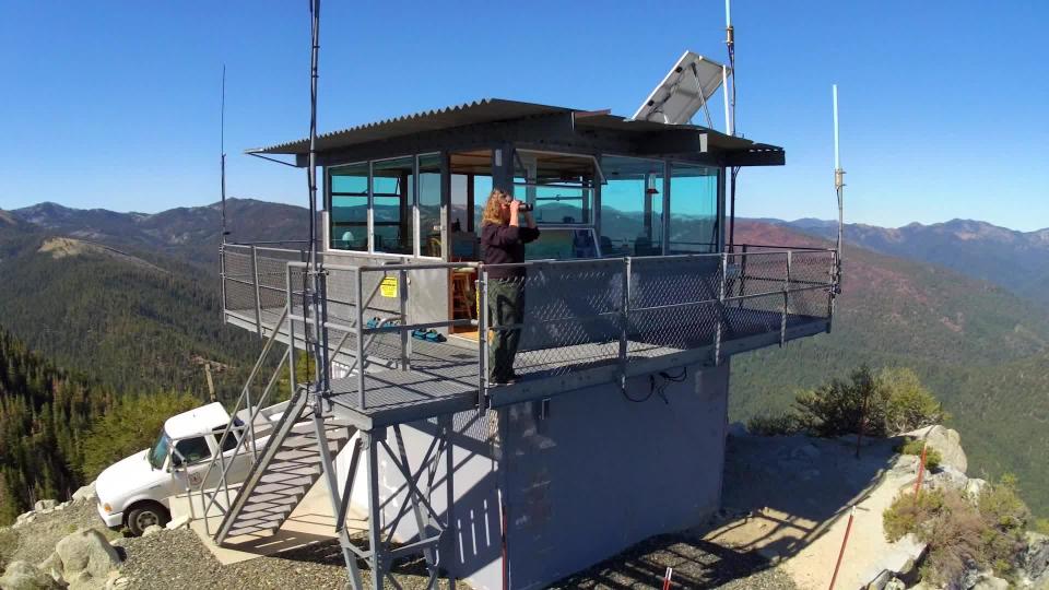 Karita Knisely keeps watch for telltale signs of fire, atop Mount Bolivar in Klamath National Forest, California.  / Credit: CBS News
