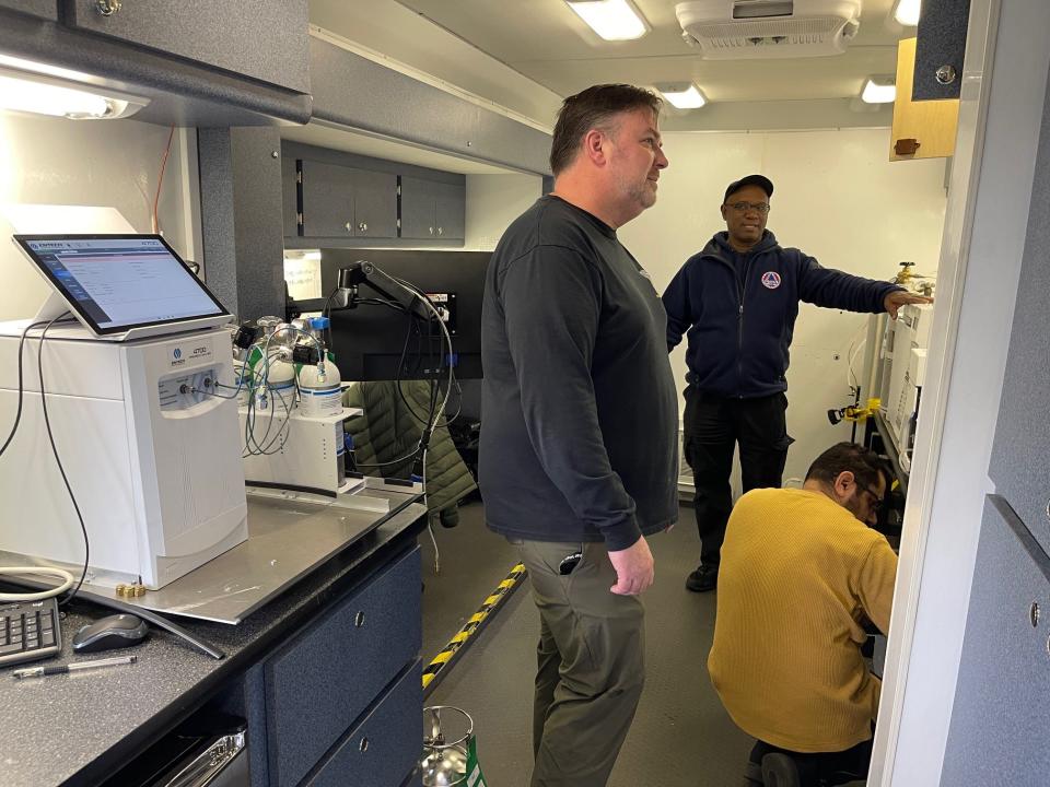 Inside the EPA's mobile lab, on-site coordinators and chemists test air samples that were collected from different locations inside the North Star High School.