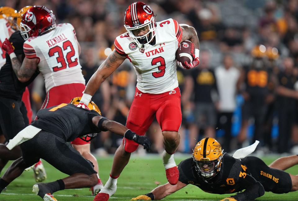 Sep 24, 2022; Tempe, Arizona, USA; Utah's Ja'Quinden Jackson (3) runs the ball as ASU defenders Jordan Clark (1) and 	Kyle Soelle (34) dives for the tackle at Sun Devil Stadium on Saturday, Sept. 24, 2022. Mandatory Credit: Joe Rondone-Arizona Republic