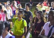 Members of the crowd capturing the moment during the rally. (Photo: Joseph Nair)