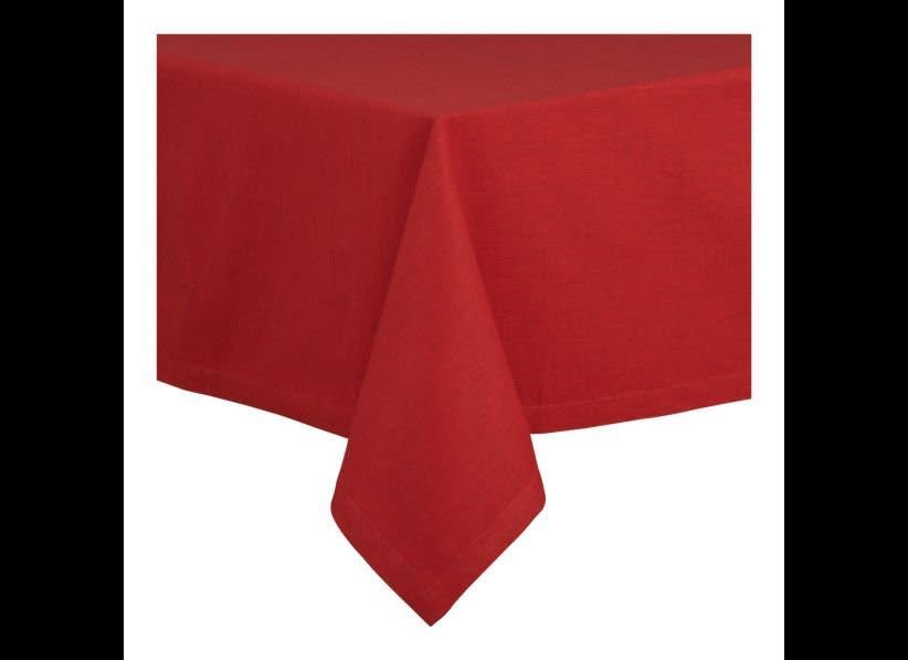 Almost matching exactly to the Ruby Red color from our palette, <a href="http://www.crateandbarrel.com/outlet/holidays/linden-60"x60"-ruby-tablecloth/s637427" target="_hplink">this tablecloth</a> will look stunning with white porcelain dishes set on top. 