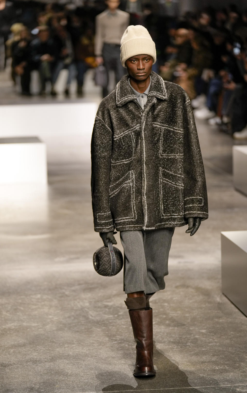 A model wears a creation as part of the men's Fendi Fall-Winter 2024-2025 collection, that was presented in Milan, Italy, Saturday, Jan. 13, 2024. (AP Photo/Antonio Calanni).