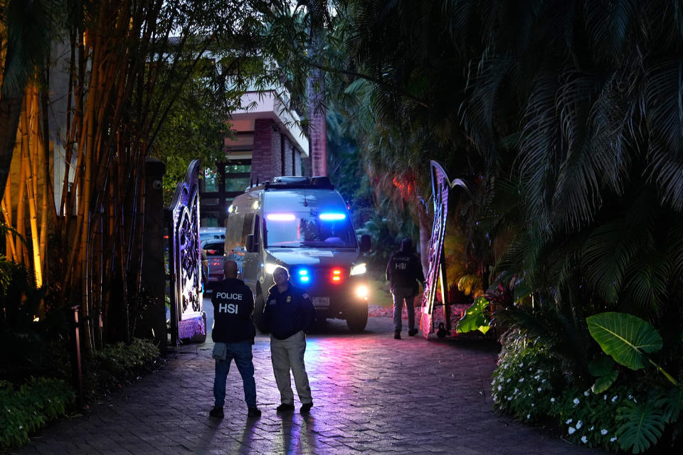 Federal agents outside one of Sean Combs' properties. (Rebecca Blackwell / AP)