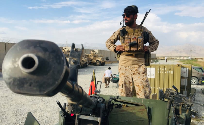 KABUL, AFGHANISTAN_JULY 05: An Afghan National Army stands on a Humvee tank who keeps watch after the US forces left Bagram airfield in the north of Kabul, Afghanistan, on July 5, 2021. The foreigner forces left Bagram airbase after nearly 20 years. Now Afghan National Army formation set up. (Photo by Haroon Sabawoon/Anadolu Agency via Getty Images)