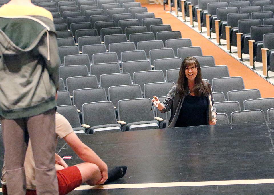 Ann VanScoy, longtime stage director and choreographer, works with Ashland High School's Sing & Swing as they rehearse for May Fiesta.