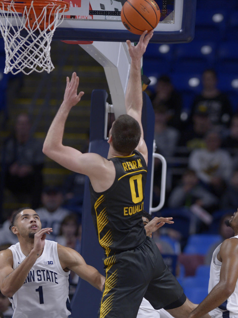 Iowa's Filip Rebraca (0) shoots over Penn State's Seth Lundy (1) during the first half of an NCAA college basketball game, Sunday, Jan. 1, 2023, in State College, Pa. (AP Photo/Gary M. Baranec)